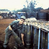 "Tom Watkins Checking a 175 mm Projo - Nov 67 Quan Loi - ABtry 6/27th Arty"